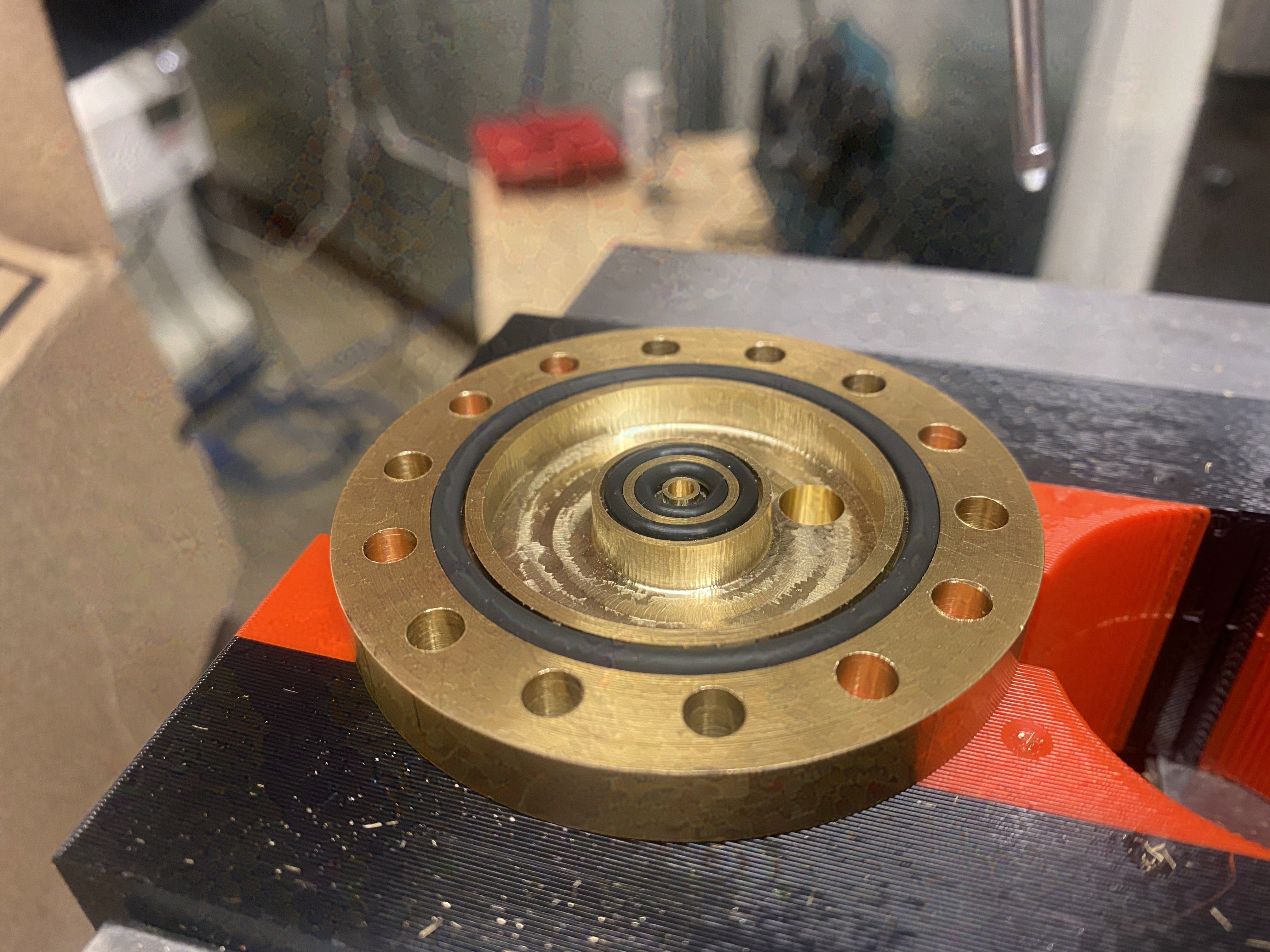 CNC-milled injector manifold on a mill bed
